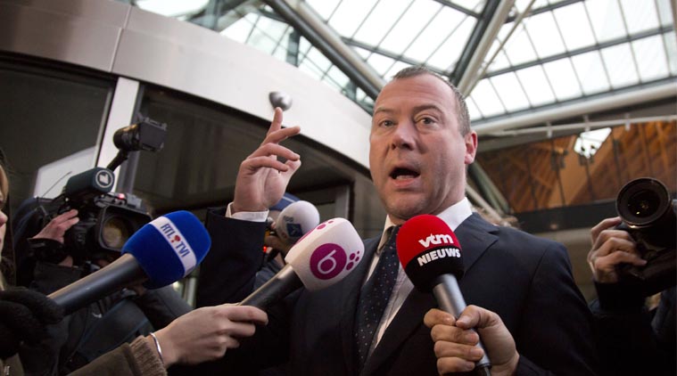 Dimitri Bontinck, father of co-defendant and key witness Jejoen Bontinck, speaks to the press as he arrives to the main courthouse in Antwerp, Belgium Wednesday, Feb. 11, 2015. (AP Photo)