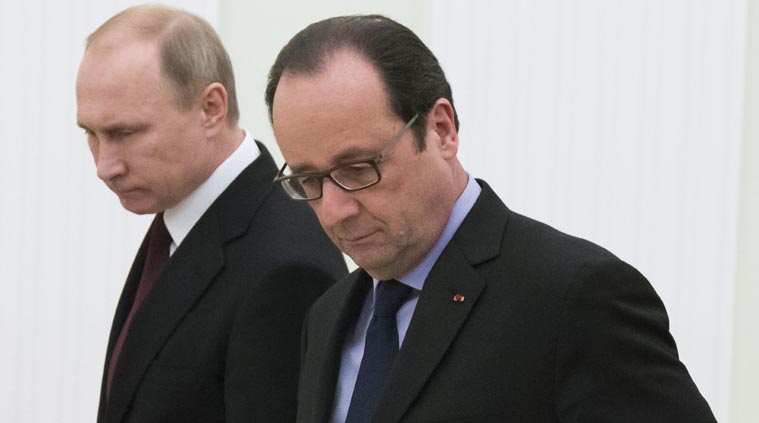 Russian President Vladimir Putin, left, and French President Francois Hollande, enter a hall for their and German Chancellor Angela Merkel's talks in the Kremlin in Moscow, Russia, Friday, Feb. 6, 2015. (AP Photo)