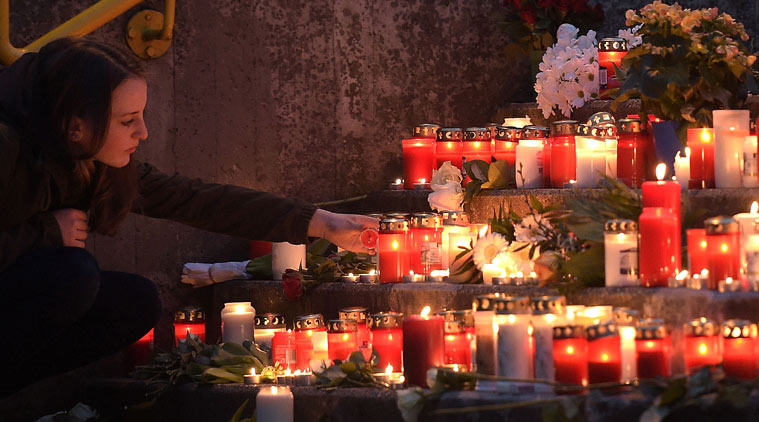 Students and well wishers light candles outside the Joseph-Koenig secondary school in Haltern, Germany.