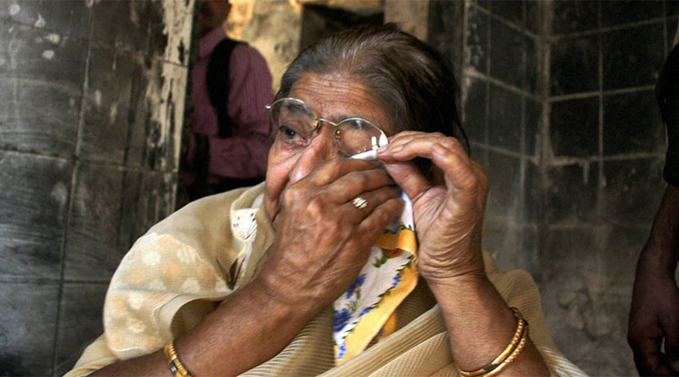 Wife of victim Ehsaan Jafari wipes her tears as she visits her old house at Gulbarg Society, on the 10th anniversary of the carnage in Ahmedabad.