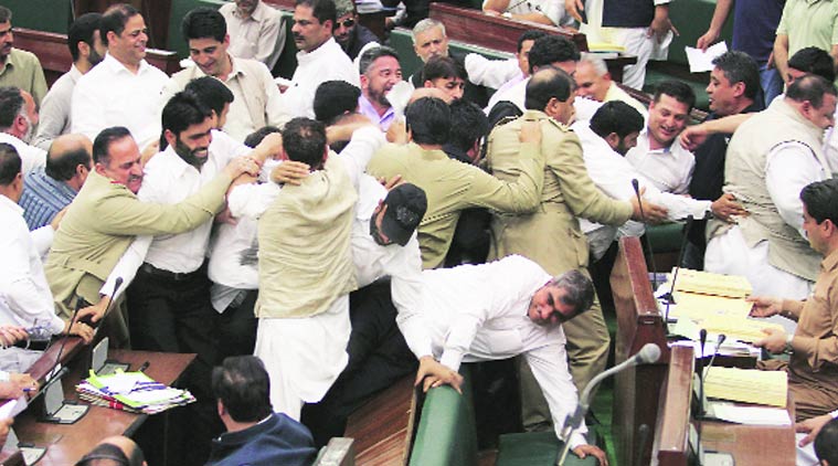 Opposition MLAs protest in the J&K Assembly on Friday. (Source: PTI photo)