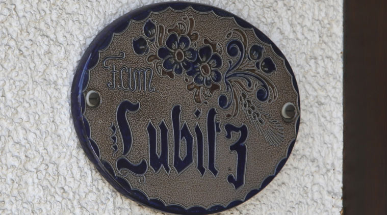 The photo shows the door sign at the house of Andreas Lubitz in Montabaur, Germany, Thursday, March 26, 2015. Andreas Lubitz was the copilot on flight Germanwings 9525 that crashed with 150 people on board on Tuesday in the French Alps. (AP Photo/Michael Probst)