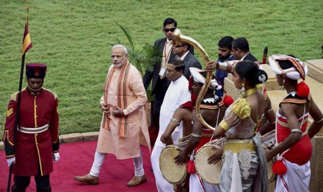 Narendra Modi, Prime Minsiter Narendra Modi, Modi, Colombo, Port Louis, Mauritius, Air India, Indian Ocean island nations, Seychelles, Mauritius, Sri Lankan President, Maithripala Sirisena, Ranil Wickramasinghe, Rajiv Gandhi, Sri Lankan Parliament, British Premier David Cameron, Jaffna, Tamil National Alliance, National Security Advisor, Ajit Doval, Foreign Secretary, S Jaishankar, India-Sri Lanka, Indo-Sri Lankan relations, India news, Sri Lanka news, National news, International news, Photos, Modi pictures, Modi lanka, Modi in Sri Lanka, Modi in Sri Lanka pictures, News