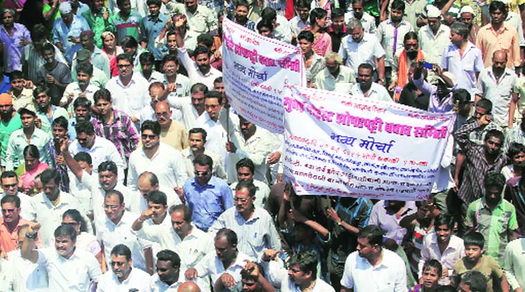 Around 8,000 people from NCP and Zopadpatti Association march towards Azad Maidan on Monday. (Source: Express photo by Ganesh Shirsekar)