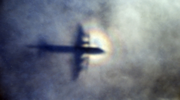 FILE - In this March 31, 2014 file photo, a ghostly shadow of a Royal New Zealand Air Force P3 Orion is cast on low level cloud while the aircraft searches for the missing Malaysia Airlines Flight 370 in the southern Indian Ocean, near the coast of Western Australia. (AP Photo/Rob Griffith, File)