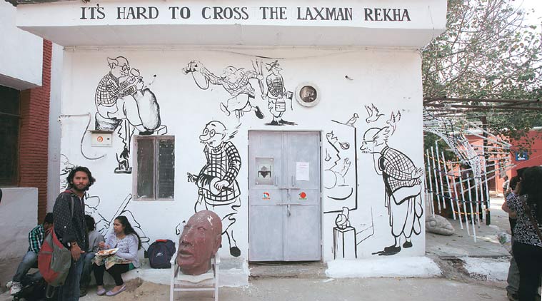 A graffiti piece, the works adorn the exteriors of a room that invites visitors into the exhibition.