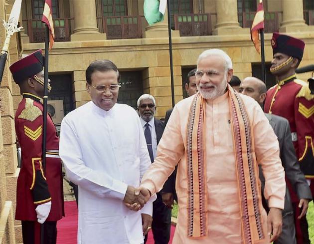 Narendra Modi, Prime Minsiter Narendra Modi, Modi, Colombo, Port Louis, Mauritius, Air India, Indian Ocean island nations, Seychelles, Mauritius, Sri Lankan President, Maithripala Sirisena, Ranil Wickramasinghe, Rajiv Gandhi, Sri Lankan Parliament, British Premier David Cameron, Jaffna, Tamil National Alliance, National Security Advisor, Ajit Doval, Foreign Secretary, S Jaishankar, India-Sri Lanka, Indo-Sri Lankan relations, India news, Sri Lanka news, National news, International news, Photos, Modi pictures, Modi lanka, Modi in Sri Lanka, Modi in Sri Lanka pictures, News