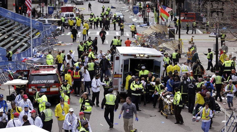  In this April 15, 2013, file photo, medical workers aid injured people following an explosion at the finish line of the 2013 Boston Marathon in Boston. Three people were killed and more than 260 were injured when twin pressure-cooker bombs exploded near the finish line. (Source: AP Photo)
