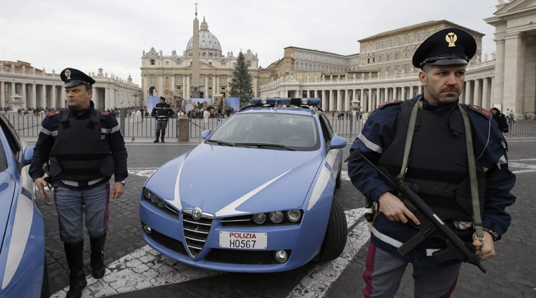 Italian police officers patrol outside St. Peter's Square in Rome. (Source: AP photo)