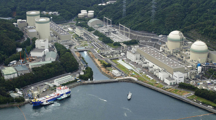 FILE - In this June 27, 2013 file photo, a freighter, left in foreground, carrying MOX, a mixture of uranium and plutonium oxide, arrives at the Takahama nuclear power station in Takahama town in Fukui prefecture, northwestern Japan, when the power plant received the first shipment of reprocessed nuclear reactor fuel from France since the 2011 Fukushima disaster that forced it to shut down reactors, hoping to use the fuel once they get the go-ahead to restart their reactors. (AP Photo)