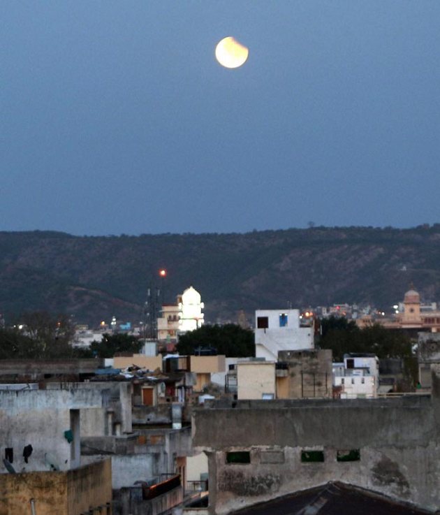People witness partial lunar eclipse across India Picture Gallery