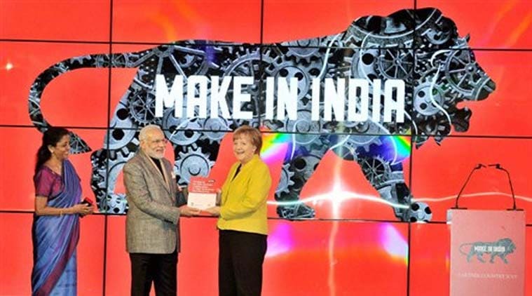 Prime Minister Narendra Modi with German Chancellor Angela Merkel at the inauguration of the India Pavilion at Hannover Messe, Germany on Monday. Minister of State for Commerce & Industry (Independent Charge), Nirmala Sitharaman is also seen. (Source: PTI)