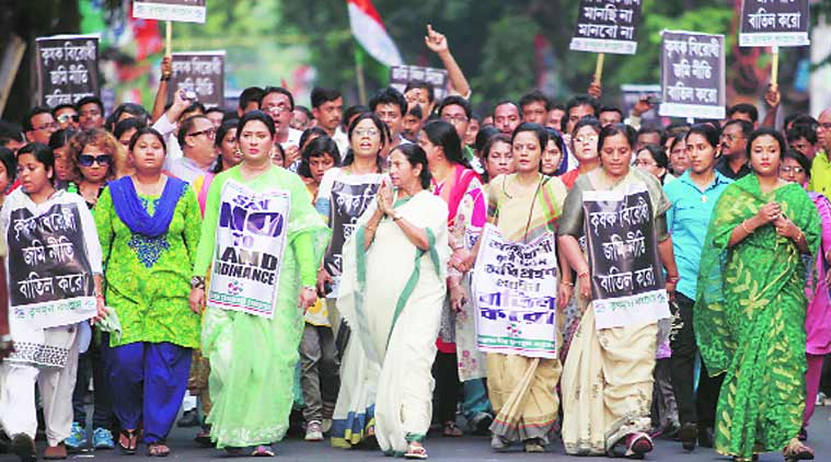Mamata Banerjee walks with her supporters in Kolkata on Wednesday against Modi government’s land bill.