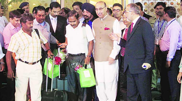Pakistan High Commissioner Abdul Basit with Indians, who were evacuated from Yemen by a Pakistani navy ship, at the IGI Airport in New Delhi on Wednesday. (Express Photo by: Amit Mehra)
