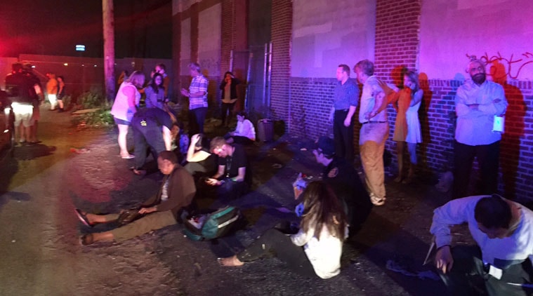 Passengers of an Amtrak train that crashed gather Tuesday, May 12, 2015, in Philadelphia. Train 188 was traveling from Washington to New York City. (AP Photo/Paul Cheung)