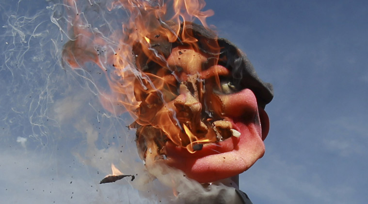 FILE - In this May 1, 2012 file photo, an effigy of Bolivia's President Evo Morales flames after demonstrators set it on fire on May Day in La Paz, Bolivia. Morales acknowledges that corruption, chiefly involving state-run industries and office-abusing prosecutors and judges, has hurt his movement. While he personally has not been accused of wrongdoing, he is blamed for not adequately investigating and punishing graft. (AP Photo/Juan Karita, File)