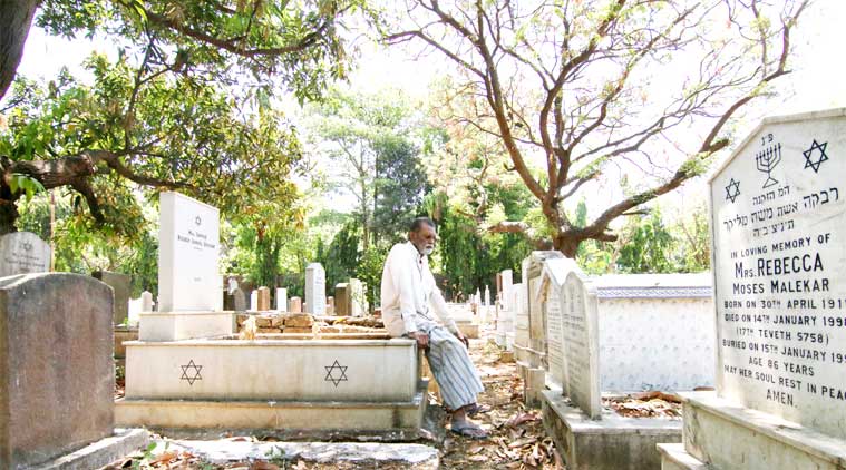 Mohammad Abdul Yaseen  looks over some of the tombstones he has engraved at the Mahalaxmi Jewish Cemetery.  (Source: Amit Chakravarty)