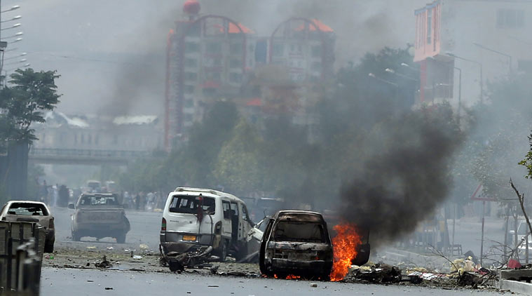Fire and smokes rise at the site of a suicide attack during clashes with Taliban fighters in front of the Parliament, in Kabul, Afghanistan, Monday, June 22, 2015. The Taliban launched a complex attack on the Afghan parliament Monday, with a suicide car bomber striking at the entrance and gunmen battling police as lawmakers were meeting inside to confirm the appointment of a defense minister, police and witnesses said. (AP Photo)
