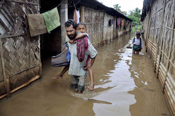 Assam flood, Assam floods, Assam monsoon, Assam monsoon flood, Brahmaputra overflowing, Assam Brahmaputra floods, Arunachal Pradesh floods, Brahmaputra tributaries floods, Assam flood affected districts, Assam MeT department, Assam Barpeta, Lakhimpur, Dhemaji floods, Assam flood news, Assam Flood photos, arunachal flood photos, Brahmaputra flood photos, india news, assam news, northeast news,