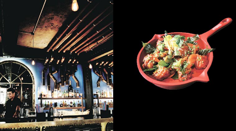 Interiors of the  two-storey restaurant, which can accommodate several hundreds  at a time, A prawn preparation served at  Hybrid; (right) a prawn preparation served at  Hybrid. (Source: Express phot by Ravi Kanojia)