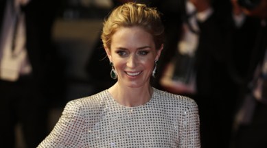 Actress Emily Blunt poses for photographers as she leaves following the screening of the film Sicario at the 68th international film festival, Cannes, southern France, Tuesday, May 19, 2015. (AP Photo/Lionel Cironneau)