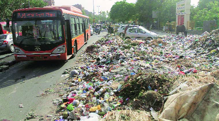 Garbage on road at Manglam  Chowk in East Delhi’s Patparganj. (Source: Express photo by Praveen Khanna)