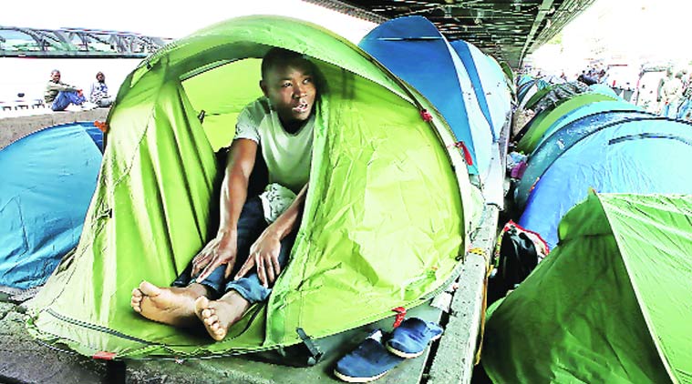 Sacre Coeur basilica, Paris migrants, migrants in Britain, East African migrants, Europe migrants, indian express, world news, international news