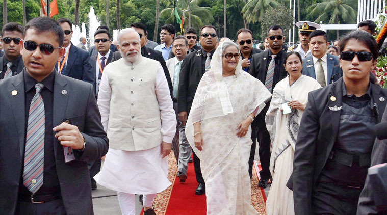 narendra modi bangladesh visit, narendra modi dhaka visit, Land Boundary Agreement, india bangladesh Land Boundary Agreement, india bangladesh LBA, Narendra Modi mamata banerjee Bangladesh visit, Bangladesh Narendra Modi mamata banerjee, narendra Modi bangladesh, Modi Bangladesh visit, Modi Bangladesh news, Modi news, Modi posters Bangladesh