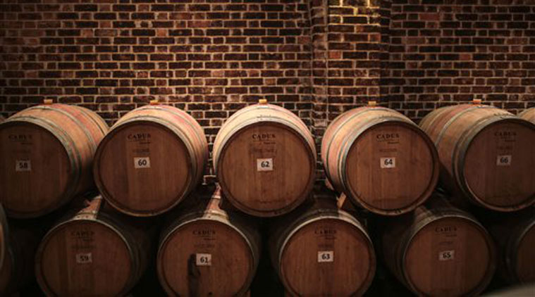 In this Wednesday, May 27, 2015 photo, oak barrels imported from France are stored in a barrel room, where produced wines are aged for at least 6 months, at the Gianaclis winery, one of Egypt's main wineries, in the Nile Delta, north of Cairo, Egypt. (AP Photo/Mosa'ab Elshamy)
