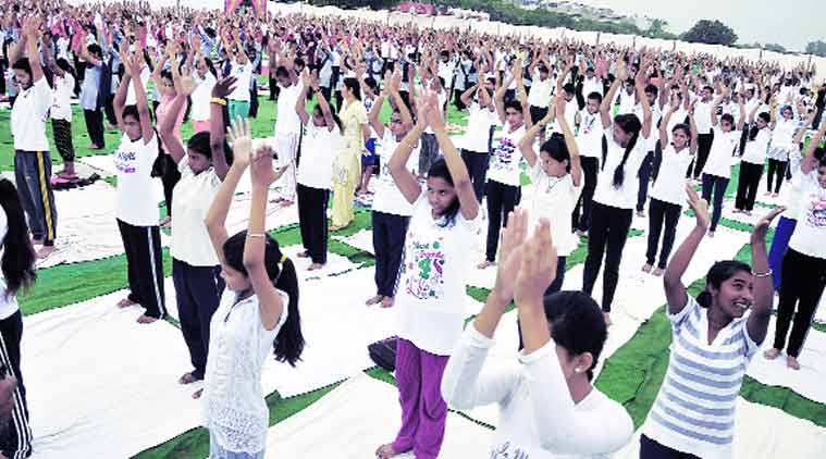 Children take part in an event to mark International Yoga Day in Chandigarh on Sunday.