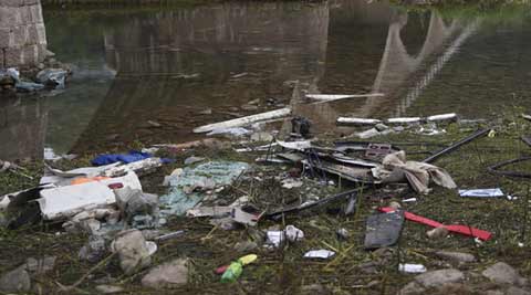 Bus falls off bridge, killing 10 South Koreans and Chinese driver