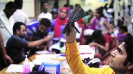 A doctor checks an X-ray in the ER of Sanjay Gandhi Memorial. (Source: Express photo by Oinam Anand)