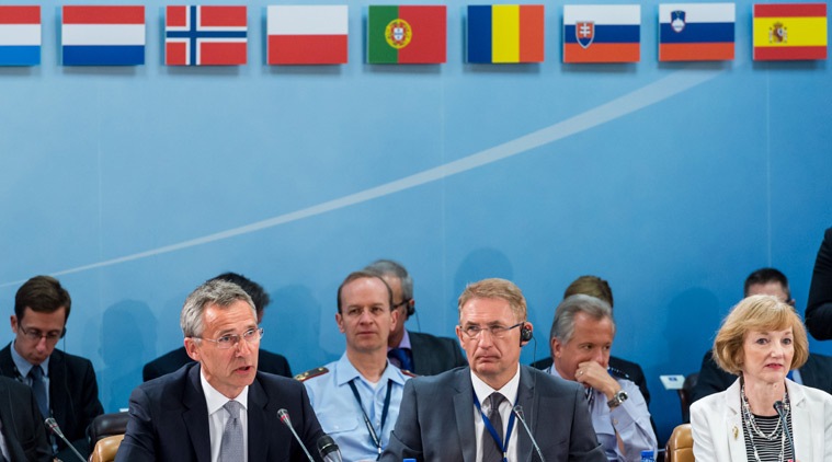 NATO Secretary General Jens Stoltenberg, left, talks during a North Atlantic Council Meeting at NATO headquarters in Brussels on Tuesday July 28, 2015. For just the fifth time in its 66-year history, NATO ambassadors met in emergency session Tuesday to gauge the threat the Islamic State extremist group poses to Turkey, and the debated actions Turkish authorities are taking in response. (AP Photo/Geert Vanden Wijngaert)