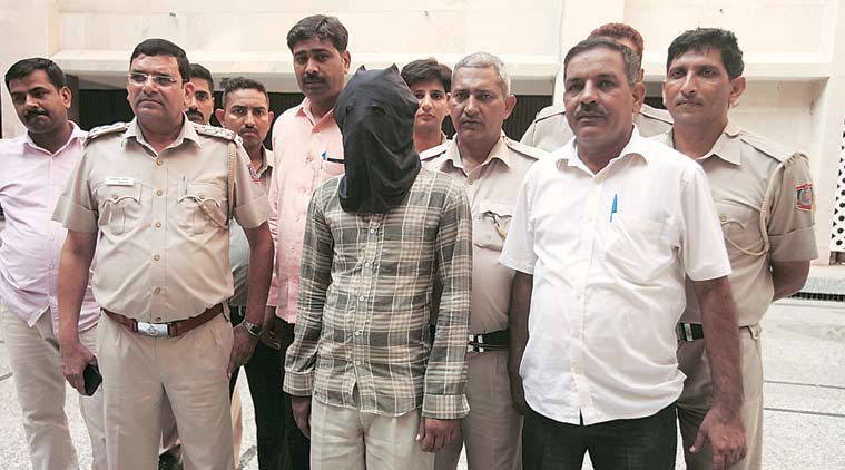 The accused Ravinder at Begumpur police station on Sunday. (Source: Express photo by Amit Mehra)