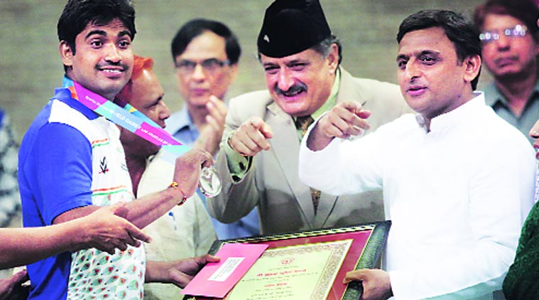 Chief Minister Akhilesh Yadav felicitates a medal-winner of ‘Special Olympics World Games: Los Angeles, 2015, during a function at his official residence, in Lucknow on Saturday. Vishal Srivastav 