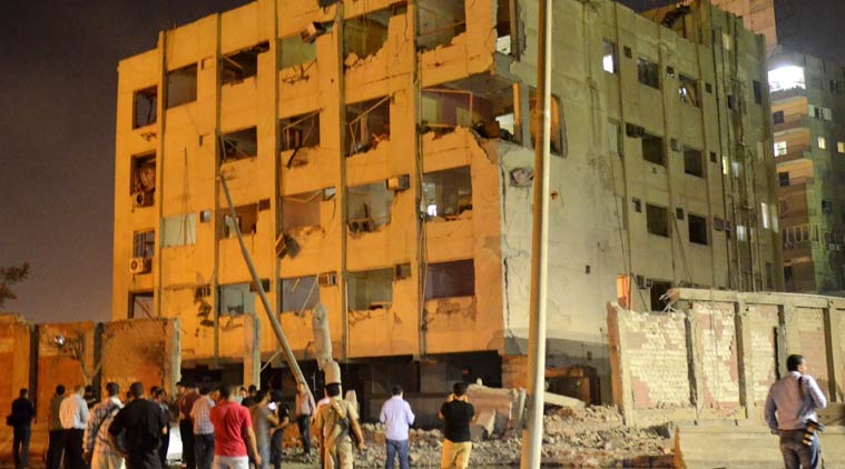 People gather near the scene where a bomb exploded early Thursday, Aug. 20, 2015, near a national security building in Cairo. (Source: AP photo)