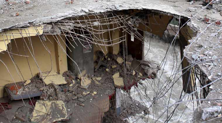 The damaged portion of a building near the historic Manikaran Sahib Gurudwara. PTI