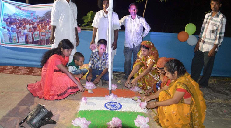 People of Mashal Danga Enclave celebrate with tricolor rangoli near India- Bangladesh border in Cooch Behar District of West Bengal, as India and Bangladesh exchange 162 adversely-held enclaves on Friday midnight. (Source: PTI Photo)