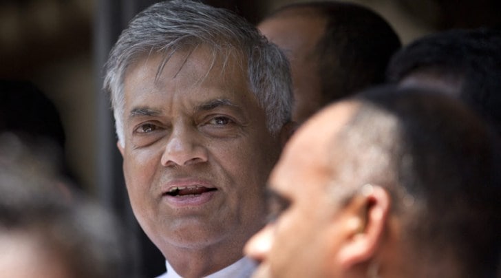 Sri Lankan Prime Minister Ranil Wickremasinghe, left, outside a polling station after casting his vote during Parliamentary elections in Colombo, Sri Lanka (AP photo)