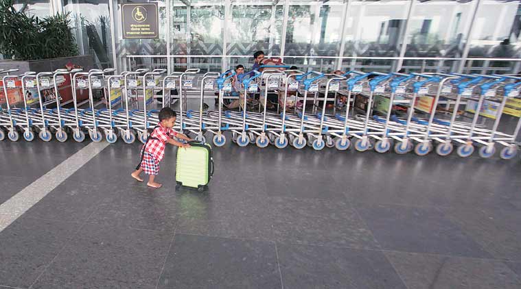 A child plays at the deserted Kolkata airport on Wednesday. The family had come to the airport on Tuesday night to catch a flight. (Source: Express photo by Subham Dutta)