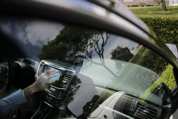 A demonstration of Android Auto in Torrance, Calif. Playing deejay with voice commands will get easier for more Americans this fall as some best-selling cars get updated with software that integrates smartphones into the dashboard. (Source: AP)