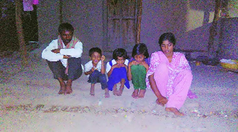 Manisha’s husband Laxman Gadkar, with their 3 daughters & one son in Ambi village. Express