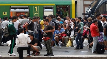 Migrants wait  at the Keleti Railway Station in Budapest, Hungary, Thursday, Sept. 3, 2015. Migrants are now allowed to enter the station but direct trains from Budapest to Western Europe are currently out of operation until further notice. (Zsolt Szigetvary/MTI via AP)