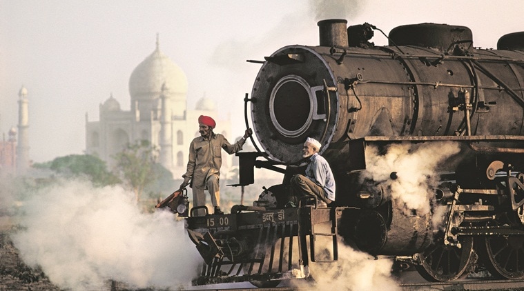 A train passes by the Taj Mahal