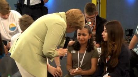 angela merkel, merkel refugee girl crying, merkel refugee crying video, Palestine girl crying Merkel, europe migrant crisis, migrant crisis, europe news, world news, latest world news