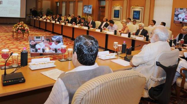 Prime Minister, Narendra Modi chairing a high-level meeting on the global economic scenario, in New Delhi on Tuesday. (PTI Photo)