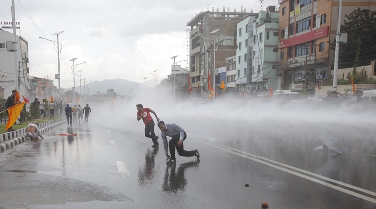 Nepalese police use water cannon to disperse Hindu protestors after they tried to enter a restricted area near the Constituent Assembly hall in Kathmandu, Nepal, Monday, Sept 14, 2015. Nepal's Constituent Assembly rejected calls to revert the Himalayan nation back to a Hindu state during voting on a draft of the long-delayed new constitution.(AP Photo/Bikram Rai)