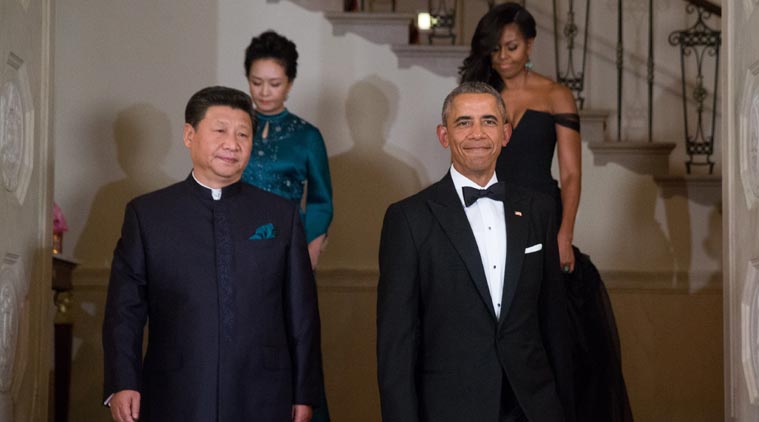 President Barack Obama, Chinese President Xi Jinping, first lady Michelle Obama and Jinping's wife Peng Liyuan descend the Grand Staircase as they arrive for a State Dinner, Friday, Sept. 25, 2015, at the White House in Washington. (Source: AP Photo)