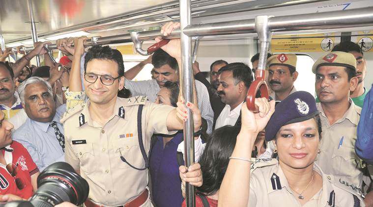  Joint Commissioner of Police (JCP) Bharti Arora and Commissioner of Police Navdeep Singh Virk take the metro on Gurgaon’s car-free day. (Express Photo by Manoj Kumar)