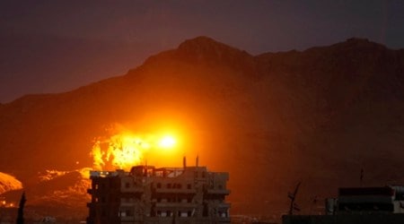 In this Thursday, Sept. 24, 2015 photo, an explosion is seen following a Saudi-led airstrike at a site believed to be one of the largest weapons depots in Sanaa, Yemen. The war in Yemen escalated in March when the Saudi-led coalition launched a campaign involving air strikes and ground troops against Shiite Houthi rebels and their allies. More than 2,100 civilians have been killed, according to U.N. estimates. The coalition recently has sought to retake rebel-held Sanaa. (AP Photo/Hani Mohammed)